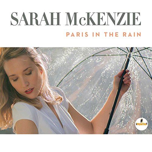CD cover for Sarah Mckenzie’s “Paris In The Rain” featuring a woman with an umbrella.