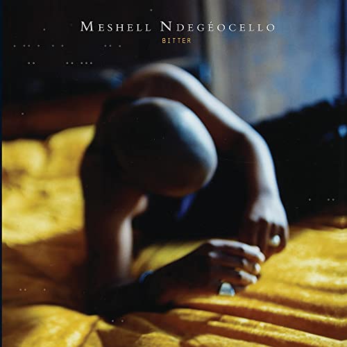 Album cover for Me’shell Ndegeocello’s “Bitter” featuring a person curled on yellow fabric.