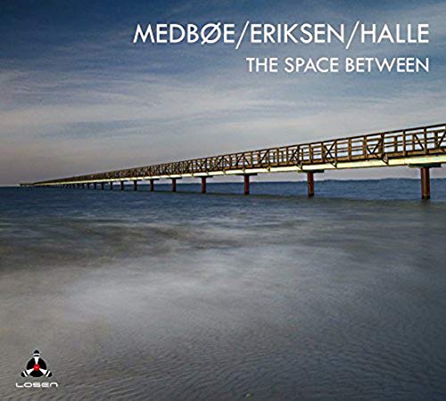 "CD cover featuring a long bridge over water at dusk, with text and logos."