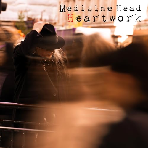 CD cover: blurry image of a person with a hat in motion.