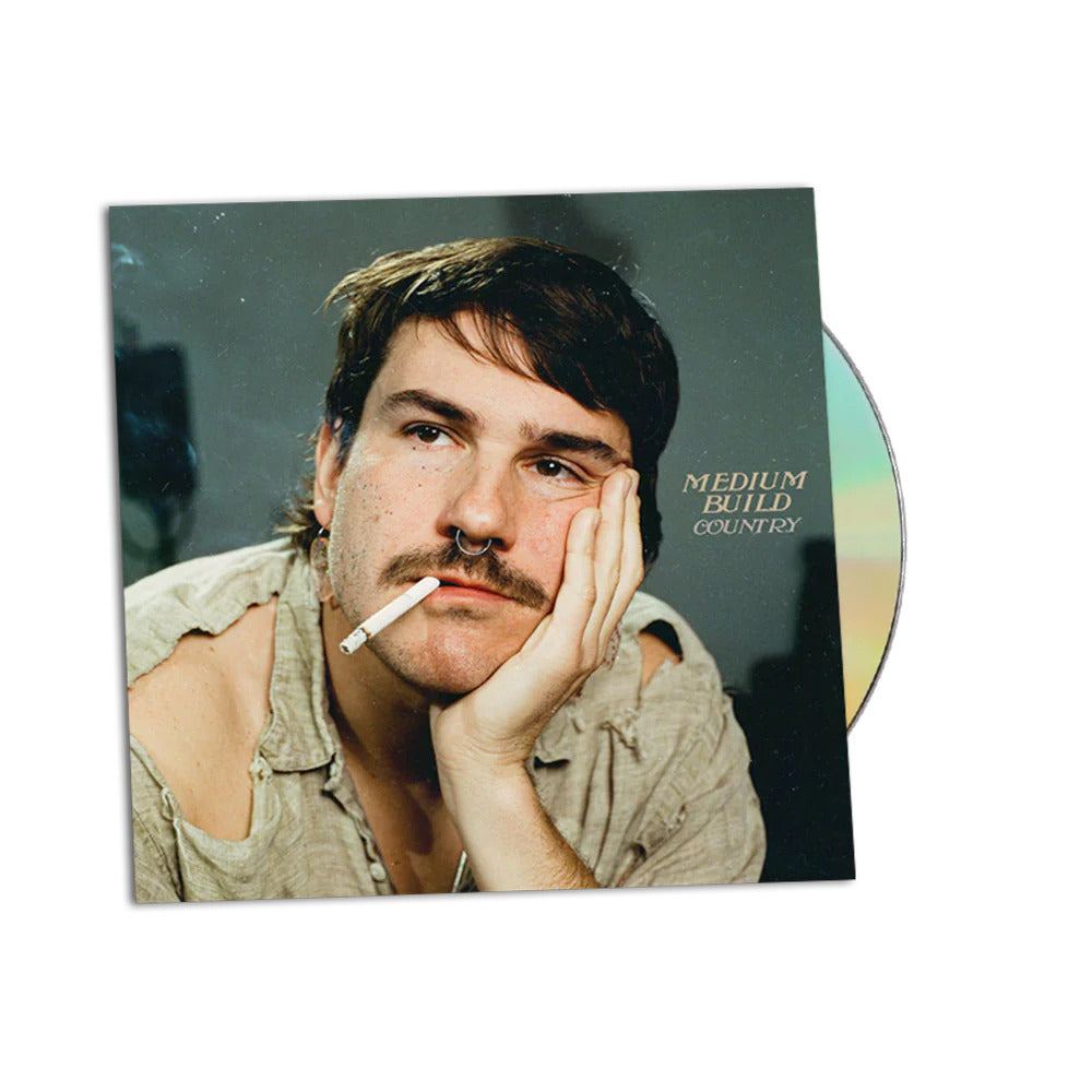 CD cover featuring a man with a mustache and nose ring, smoking.