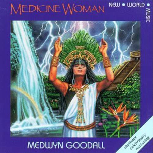 CD cover: woman with raised arms before a waterfall and stormy sky.