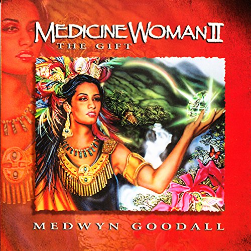 CD cover: woman in ornate jewelry with glowing, fantastical landscape.