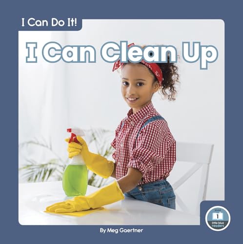 Child with yellow gloves spraying and wiping a white surface.