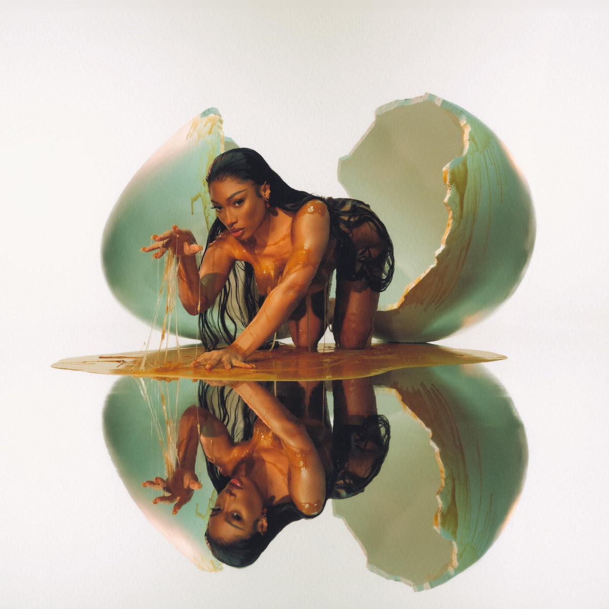 Megan Thee Stallion emerging from a cracked, golden egg with a reflection.
