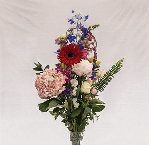CD cover with a colorful, abundant bouquet of wildflowers in a vase.