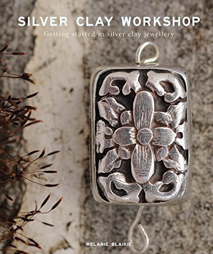 Book cover featuring a detailed, floral silver clay pendant.