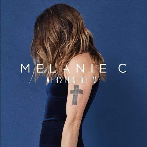 Melanie C album cover: woman with long hair, back view, tattoo.