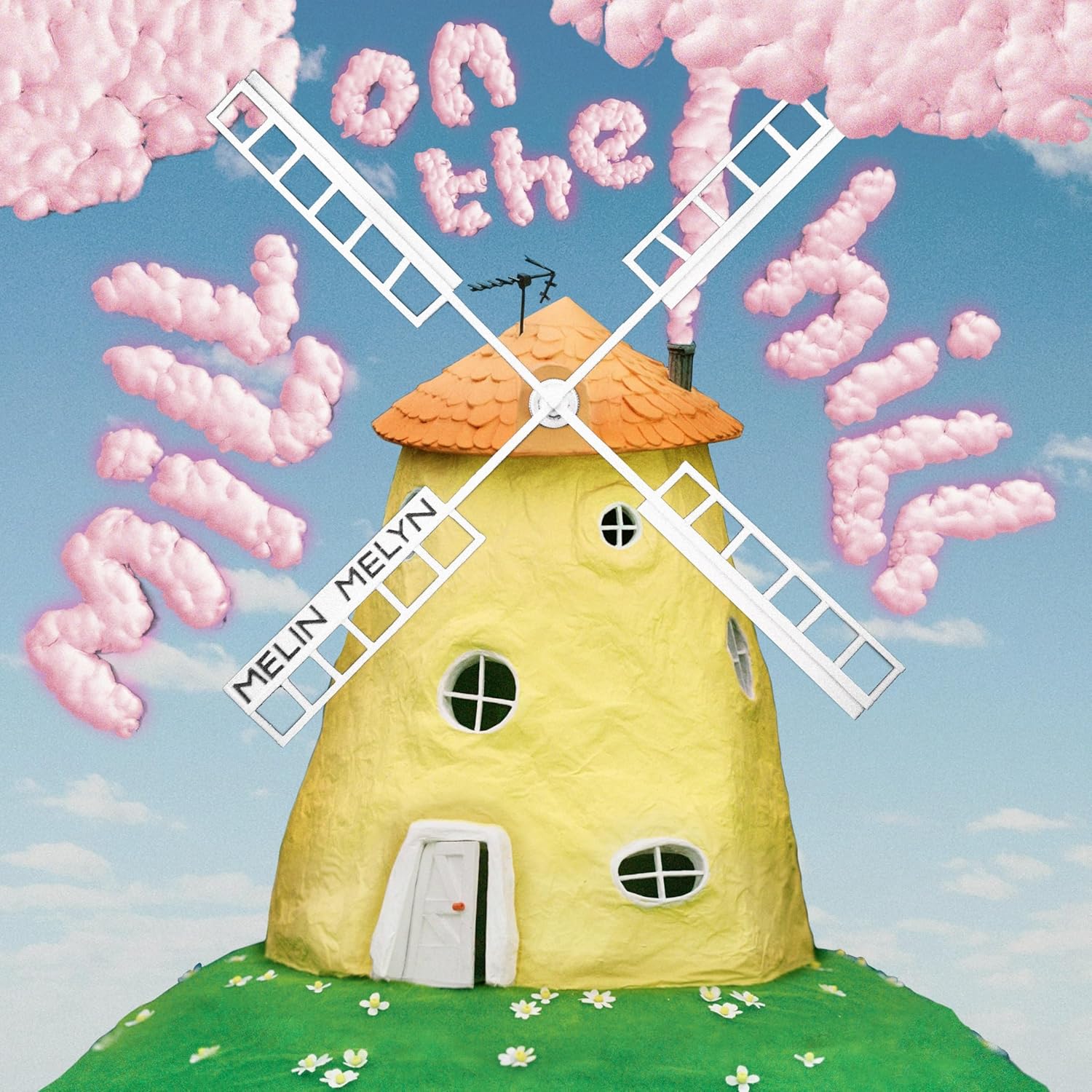 CD cover: yellow windmill with pink clouds on a blue sky.