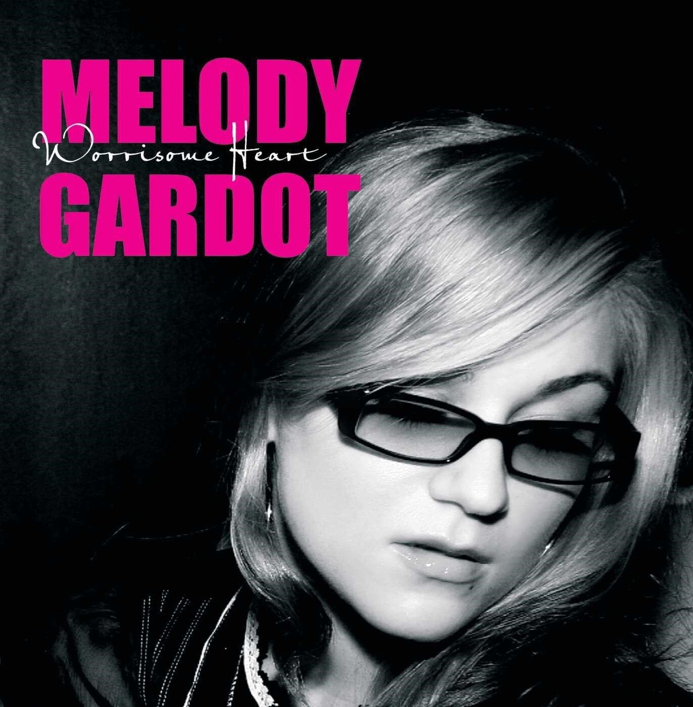 Album cover featuring Melody Gardot in glasses, with pink text overlay.