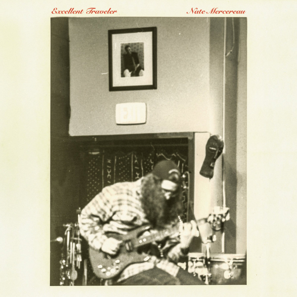 Sepia-toned album cover featuring a musician playing guitar indoors.