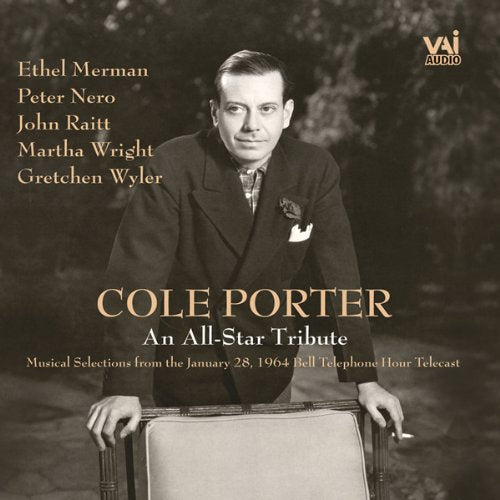 "Black and white CD cover featuring a man standing behind a chair."