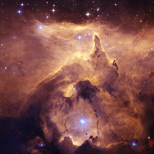 Nebula with golden and brown cosmic clouds and bright stars in deep space.