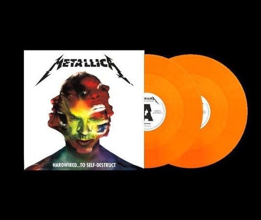 Metallica album cover and two orange vinyl records against black.