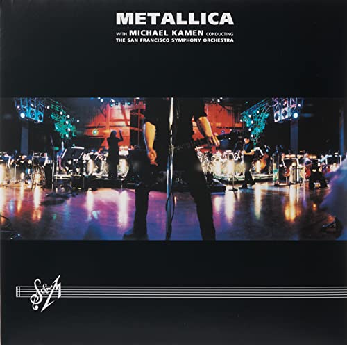 Metallica S&M album cover showing the band performing live with an orchestra on stage.