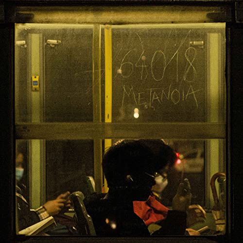 CD cover with handwritten text and blurred figures seen through a window.