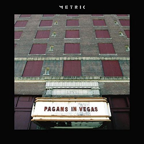 "Album cover featuring a building facade with a 'Pagans in Vegas' marquee sign."