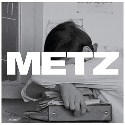 Black and white album cover for Metz, featuring a person and text.