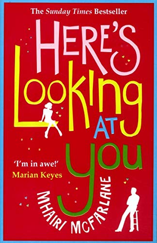 Red book cover with colorful title text and silhouetted figures.