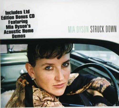 Mia Dyson “Struck Down” CD cover: woman looking forward in a car.