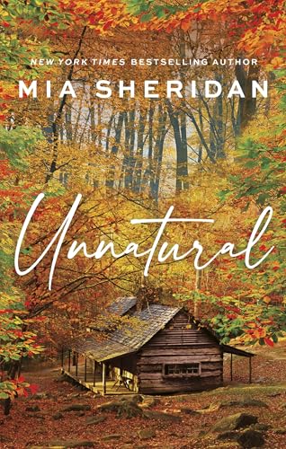 Book cover for “Unnatural” featuring a cabin in a fall forest.