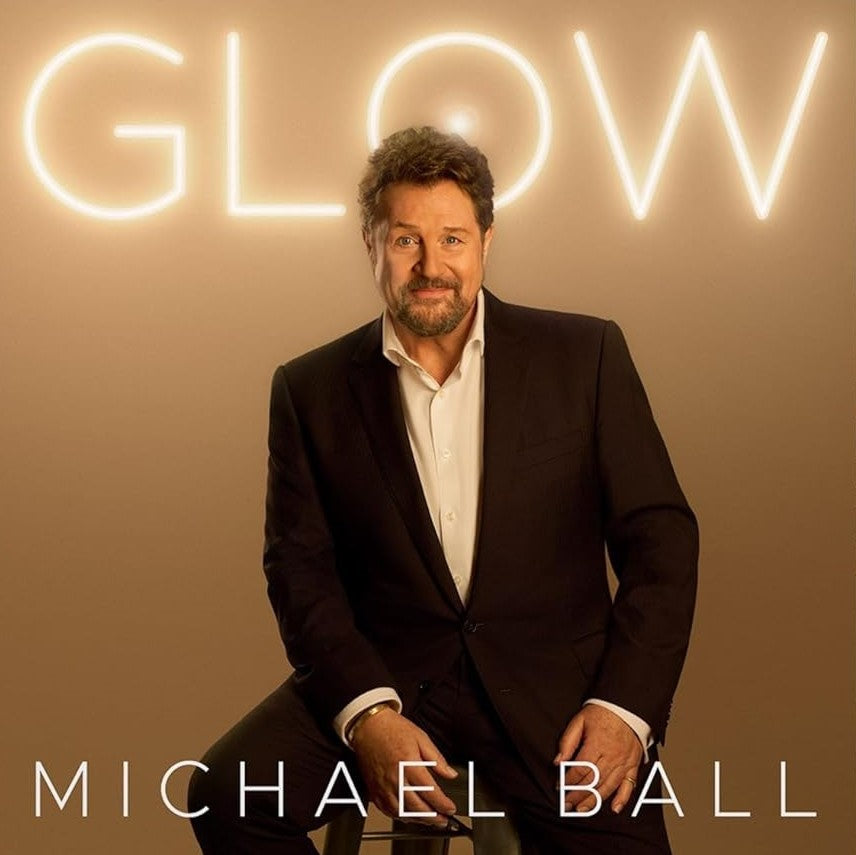 Michael Ball portrait with glowing “GLOW” text and name below.