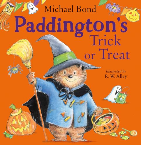 Paddington Bear dressed as a witch holding a broomstick and a pumpkin candy bucket.