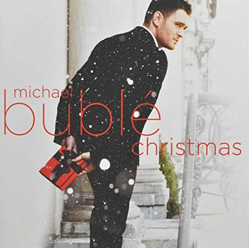 Michael Bublé "Christmas" album cover with a man in a suit and gift.