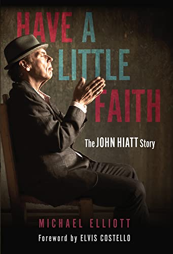 Book cover featuring John Hiatt in a hat and suit with hands clasped.