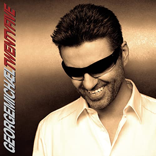 George Michael album cover, close-up of him wearing sunglasses and smiling.