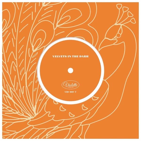 Orange vinyl record with peacock-like line art and central label.