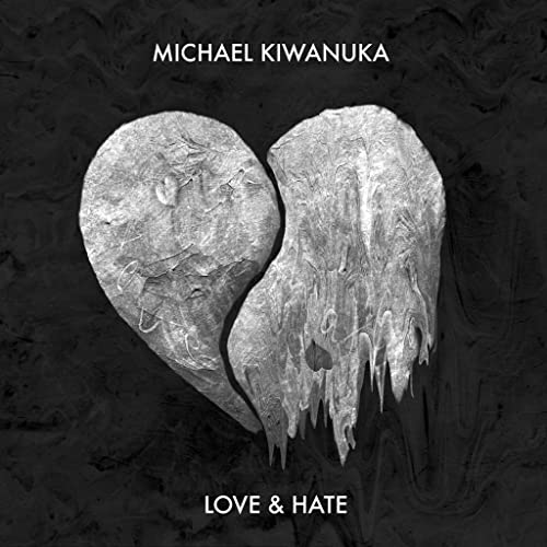 Album cover featuring a textured, silver heart shape on a dark, marbled background.