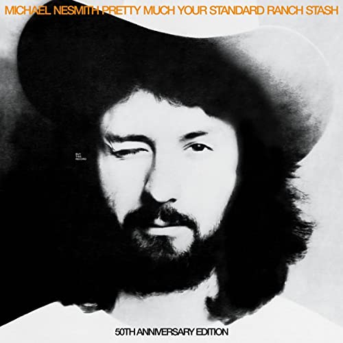 Black and white portrait of Michael Nesmith wearing a cowboy hat.