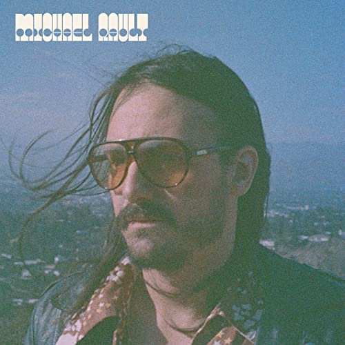 Album cover for Michael Rault featuring a man with sunglasses and mustache.