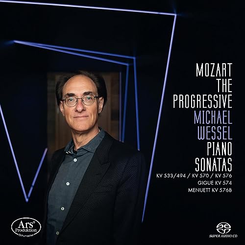 CD cover featuring pianist Michael Wessel with geometric blue lines.