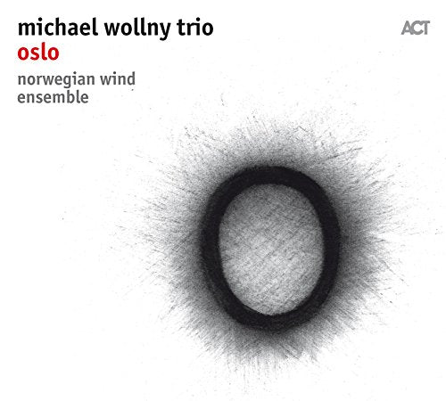 CD cover for Michael Wollny Trio’s “Oslo” with abstract dark circle design.