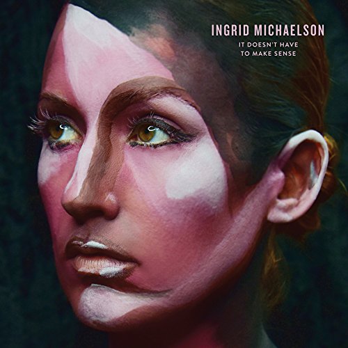 "Album cover featuring a close-up of a woman's face with abstract painted design."