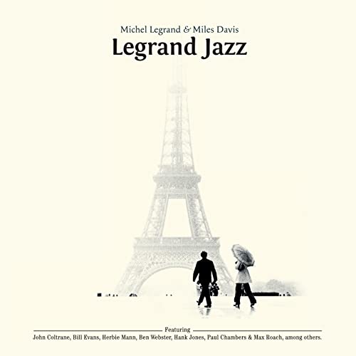 Album cover showing a couple walking toward the Eiffel Tower in a misty scene.