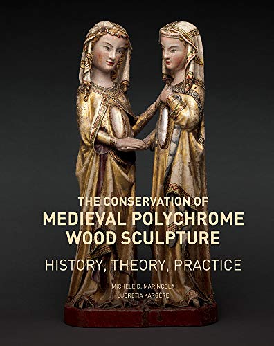 Two medieval polychrome wood sculptures of women with book cover text.