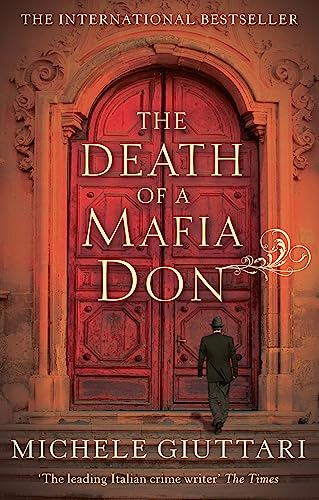 Book cover: red door, man walking away, title “The Death Of A Mafia Don”.