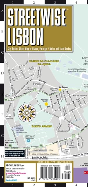 Folded, laminated street map of Lisbon, Portugal, with street names and a compass rose.