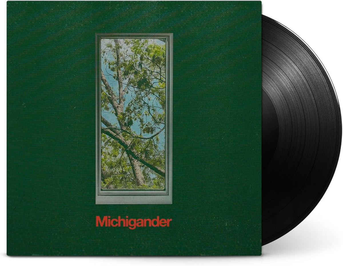 Vinyl record cover featuring a window view of trees on green background with text.