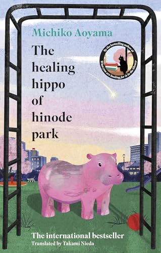 Book cover: pink hippo statue under a metal arch, city background.