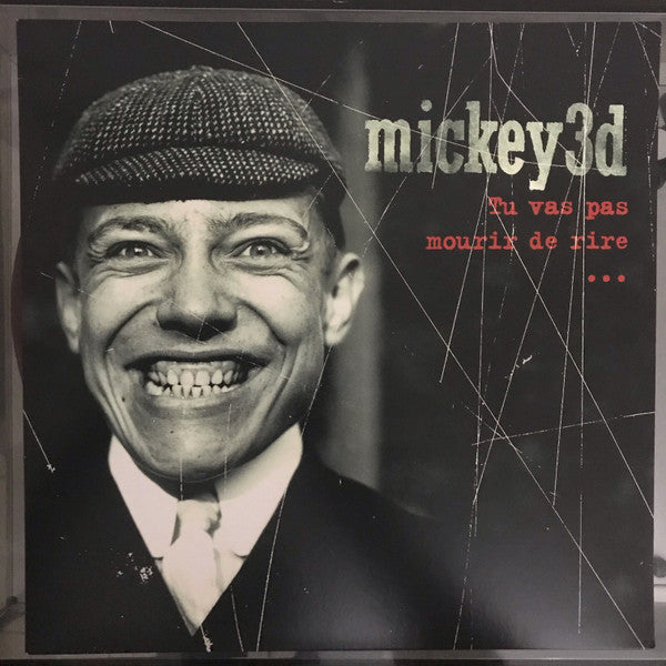 Vinyl record cover featuring a smiling man with a cap and red text.