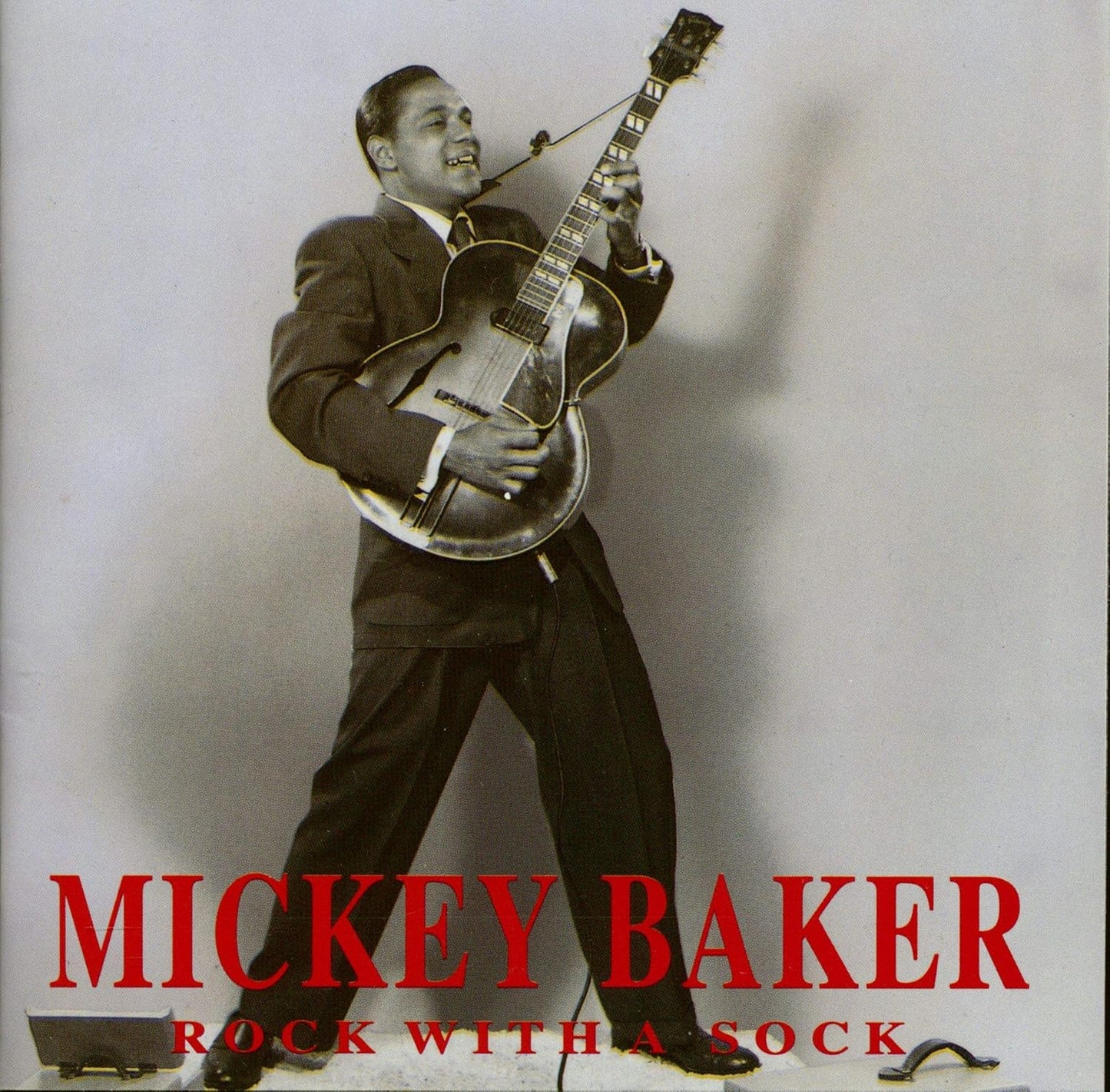 Mickey Baker playing guitar, album cover for "Rock With A Sock".