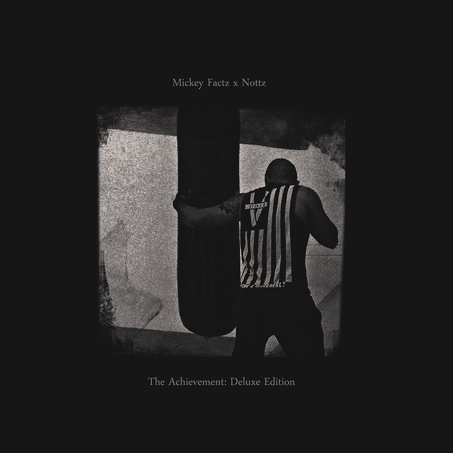 Black and white album cover featuring a shadowed figure with text.