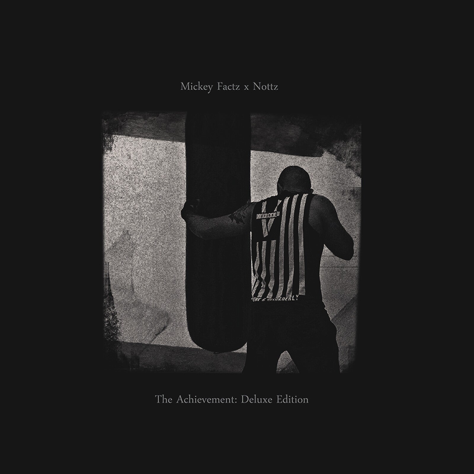 Black and white album cover featuring a shadowed figure with text.