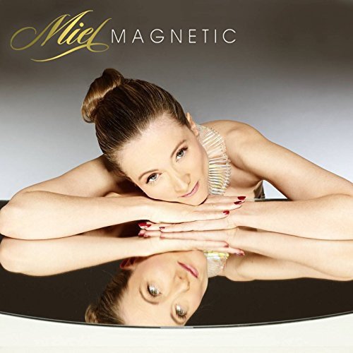 CD cover featuring a woman lying on a reflective surface.