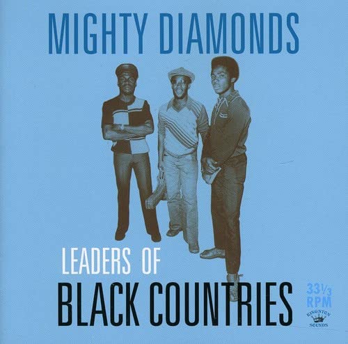 Three men standing against a light blue background with album title text.