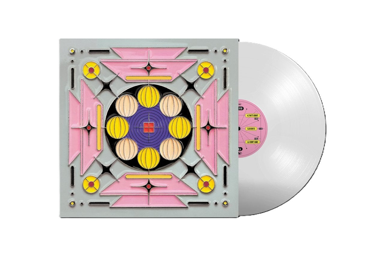 Clear vinyl LP with colorful geometric album cover art.